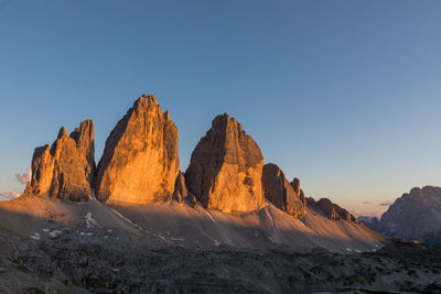 Panoramic view of mountains against clear sky
