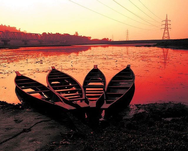 sunset, water, transportation, boat, nautical vessel, tranquility, orange color, tranquil scene, sky, lake, reflection, moored, nature, scenics, beauty in nature, mode of transport, outdoors, clear sky, sea, idyllic