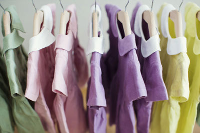 Colorful dresses hanging on rack