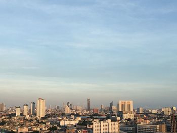 Buildings in city against sky