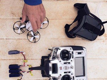 Young man prepares the drone for flight