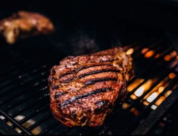 High angle view of meat on barbecue grill