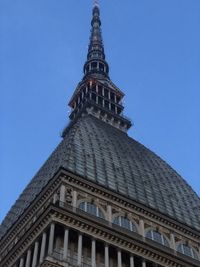 Low angle view of historical building against clear blue sky