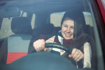 Low angle view of woman in car