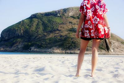 Woman standing on beach