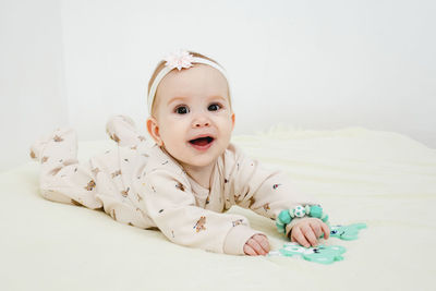 Portrait of cute baby boy sleeping on bed at home