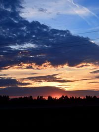 Scenic view of silhouette mountains against sky during sunset