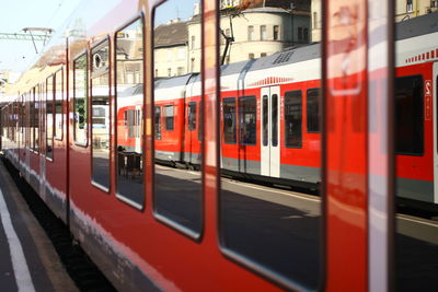 Reflection on train by platform