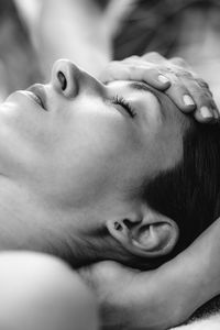 Cranial osteopathy massage. therapist massaging womans head.