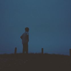 Woman standing on field