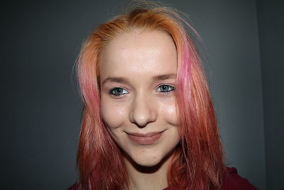 Close-up portrait of a smiling young woman