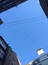 Low angle view of building against blue sky