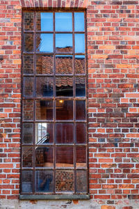 Window on brick wall of building