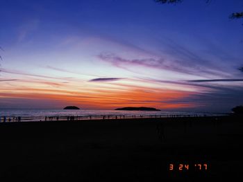 Scenic view of sea against sky at sunset