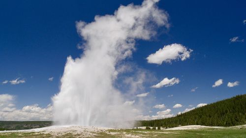 Panoramic view of waterfall against sky