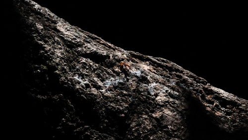 Low angle view of rock formation at night