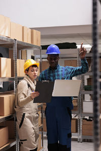 Rear view of man working at construction site