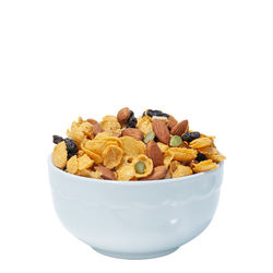 Close-up of fruits in bowl against white background