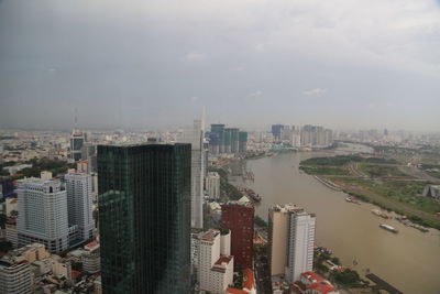 High angle view of buildings in city against sky