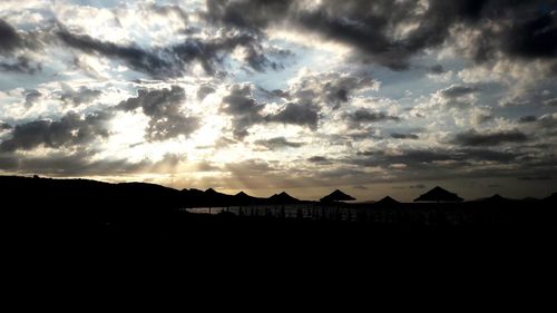 Scenic view of silhouette mountains against sky during sunset