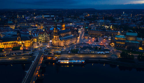 High angle view of illuminated city buildings at night