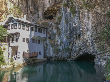 Scenic view of river by buildings