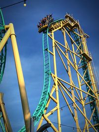 Low angle view of rollercoaster against sky