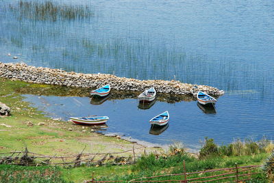 High angle view on boats moored at lakeshore