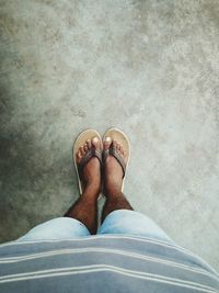 Low section of man standing on floor