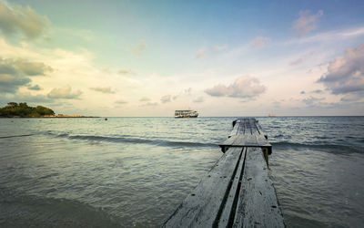 Pier over sea against sky