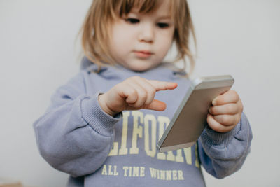 Portrait of cute girl holding gift