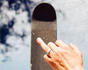 Close-up of hand holding cigarette