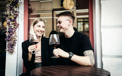 Young man in a drinking glass outdoors