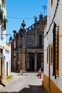 People walking in front of building