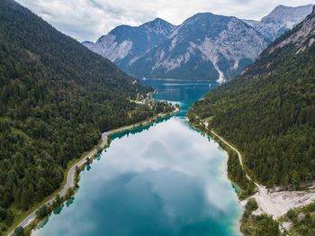 Scenic view of river amidst mountains