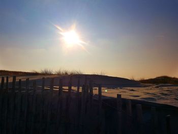 Scenic view of landscape against clear sky during sunset