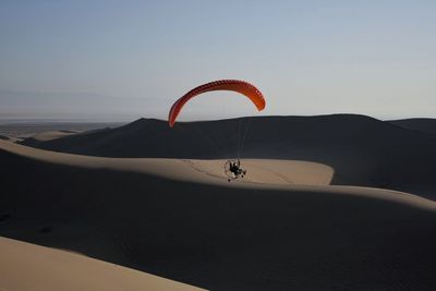 Low angle view of parachute on mountain