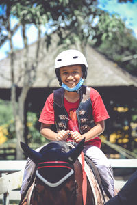 Full length of man riding horse