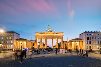 Group of people in front of historical building