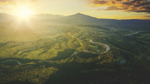 Scenic view of landscape against sky during sunset