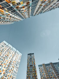 Low angle view of modern buildings against sky