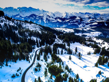 Scenic view of snowcapped mountains against sky