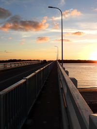 Street against sky during sunset