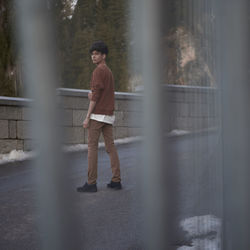 Portrait of man standing outdoors during winter