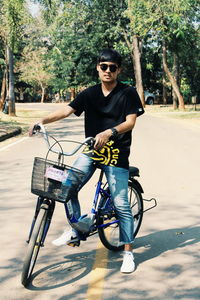 Man riding bicycle on road