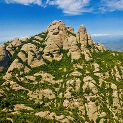 Rock formations on mountain against sky