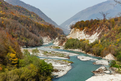 High angle view of river amidst mountains