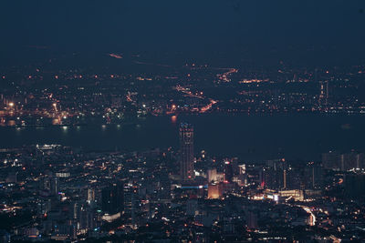 High angle view of illuminated city buildings at night