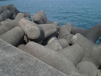 High angle view of pebbles on shore