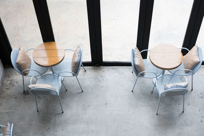 High angle view of empty chairs on table